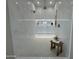 Spacious walk-in shower featuring marble tiling and a built-in bench at 3525 S Kings Ranch Ct # 4, Gold Canyon, AZ 85118