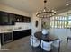 Modern wet bar with dark cabinetry and wine storage at 3525 S Kings Ranch Ct # 4, Gold Canyon, AZ 85118