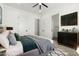 Contemporary main bedroom with neutral tones, ceiling fan, and access to ensuite bathroom and closet at 31712 N 169Th Ave, Surprise, AZ 85387