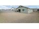 Home with backyard and patio; view of gravel yard at 12200 E Chevelon Trl, Gold Canyon, AZ 85118