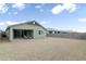 Home with backyard and patio; view of gravel yard at 12200 E Chevelon Trl, Gold Canyon, AZ 85118