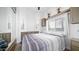 Comfortable bedroom with striped bedding and mirrored closet at 724 Emerald Dr, Apache Junction, AZ 85119