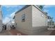 Side view of a light beige mobile home with AC unit and walkway at 724 Emerald Dr, Apache Junction, AZ 85119