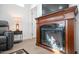 Elegant wooden fireplace with glass front at 724 Emerald Dr, Apache Junction, AZ 85119