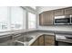Clean kitchen with double sink and modern gray countertops at 724 Emerald Dr, Apache Junction, AZ 85119