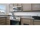 Sleek kitchen with stainless steel stovetop and built-in microwave at 724 Emerald Dr, Apache Junction, AZ 85119
