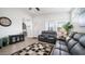 Bright and airy living room with gray reclining sofas at 724 Emerald Dr, Apache Junction, AZ 85119