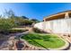 Landscaped backyard with artificial turf and pathway at 9025 N Flying Butte --, Fountain Hills, AZ 85268