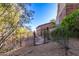 Landscaped backyard with a pathway and wrought iron gate at 9025 N Flying Butte --, Fountain Hills, AZ 85268