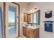 Bathroom with wood vanity, single sink, and door to patio at 9025 N Flying Butte --, Fountain Hills, AZ 85268