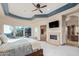 Main bedroom with cozy fireplace and access to ensuite bathroom at 9025 N Flying Butte --, Fountain Hills, AZ 85268