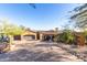 Front view of a luxurious, Spanish-style home with a large driveway and mature landscaping at 9025 N Flying Butte --, Fountain Hills, AZ 85268