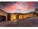 Evening view of the home's entryway and driveway, beautifully lit at 9025 N Flying Butte --, Fountain Hills, AZ 85268