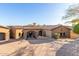 Front view of a luxurious, Spanish-style home with a large driveway and mature landscaping at 9025 N Flying Butte --, Fountain Hills, AZ 85268