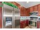 Kitchen boasts stainless steel appliances and rich wood cabinetry at 9025 N Flying Butte --, Fountain Hills, AZ 85268