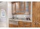 Wet bar with granite countertop and glass-front cabinets at 9025 N Flying Butte --, Fountain Hills, AZ 85268