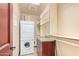 Laundry room with washer, dryer, and storage shelves at 9025 N Flying Butte --, Fountain Hills, AZ 85268