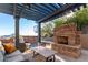 Stone patio with a fireplace and comfortable seating area at 9025 N Flying Butte --, Fountain Hills, AZ 85268