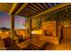 Outdoor fireplace and seating area under a pergola at 9025 N Flying Butte --, Fountain Hills, AZ 85268