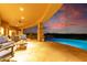 Covered patio with comfortable seating overlooking the pool and city lights at 9025 N Flying Butte --, Fountain Hills, AZ 85268