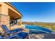 Infinity pool with lounge chairs and breathtaking mountain views at 9025 N Flying Butte --, Fountain Hills, AZ 85268