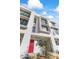 Modern townhouse exterior with red door and landscaping at 312 E Windsor Ave # 1, Phoenix, AZ 85004