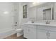 Bathroom with double sinks, large mirror, and well-lit tub/shower combo at 18795 E Elizar Dr, Gold Canyon, AZ 85118