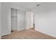 Bright bedroom features neutral carpet, ample closet space, and a door leading to other areas at 18795 E Elizar Dr, Gold Canyon, AZ 85118