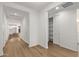Hallway features wood floors and provides access to various rooms, including a closet at 18795 E Elizar Dr, Gold Canyon, AZ 85118