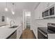 Well-designed kitchen with stainless steel appliances, white cabinets, and an open layout at 18795 E Elizar Dr, Gold Canyon, AZ 85118