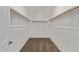 A spacious walk-in closet featuring ample shelving and storage space at 18795 E Elizar Dr, Gold Canyon, AZ 85118