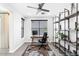 Bright home office with a large window, desk, chair, and stylish shelving at 5100 E Rancho Paloma Dr # 2077, Cave Creek, AZ 85331