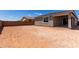Backyard featuring a dirt landscape, a small covered patio and a stucco exterior at 18507 E Camila Dr, Gold Canyon, AZ 85118