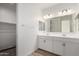 Well-lit bathroom with double sink vanity, white cabinets, and a spacious layout at 18507 E Camila Dr, Gold Canyon, AZ 85118