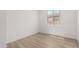 Bedroom featuring hardwood floors, a bright window, and neutral wall color at 18507 E Camila Dr, Gold Canyon, AZ 85118