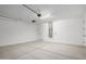 An empty, bright and clean garage featuring a gray door and concrete floors at 18507 E Camila Dr, Gold Canyon, AZ 85118