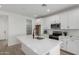 Modern kitchen featuring white cabinets, a central island with a sink, and stainless steel appliances at 18507 E Camila Dr, Gold Canyon, AZ 85118