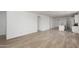 Open concept living space with wood-look floors and a view into the kitchen at 18507 E Camila Dr, Gold Canyon, AZ 85118