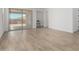 Spacious living area featuring wood-look flooring and sliding glass doors to the outdoor patio at 18507 E Camila Dr, Gold Canyon, AZ 85118