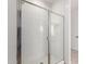 Modern shower featuring a glass enclosure and bright white tiled walls at 18507 E Camila Dr, Gold Canyon, AZ 85118