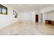 Spacious basement area with travertine floors, recessed lighting, and multiple windows at 11070 E Rolling Rock Dr, Scottsdale, AZ 85262