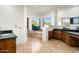 Bathroom featuring dual vanities, travertine floors, step up tub, and picturesque views at 11070 E Rolling Rock Dr, Scottsdale, AZ 85262