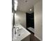 A view of a bathroom featuring double sinks and a black-tiled shower at 4030 N Palm Cir, Eloy, AZ 85131