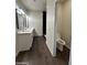 Bathroom features double sinks, a walk-in black tiled shower, and a toilet at 4030 N Palm Cir, Eloy, AZ 85131