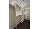 A spacious walk-in closet with plenty of shelves and racks for storage at 4030 N Palm Cir, Eloy, AZ 85131