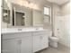 Bathroom with double sink vanity with white cabinets, a tub, and a neutral paint color at 18740 E Elizar Dr, Gold Canyon, AZ 85118