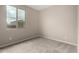 Neutral bedroom featuring carpet and a large window for natural light at 18740 E Elizar Dr, Gold Canyon, AZ 85118