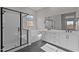 Modern bathroom showcasing a walk-in shower, soaking tub, and vanity with sleek fixtures and ample counter space at 4315 S 123Rd Ave, Avondale, AZ 85323