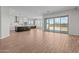 Spacious living area boasts wood-style floors, abundant natural light, and seamless access to the outdoor space at 4315 S 123Rd Ave, Avondale, AZ 85323