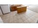 Basement wet bar area with tile flooring, cabinets and a sink at 15303 E Rio Verde Dr, Scottsdale, AZ 85262